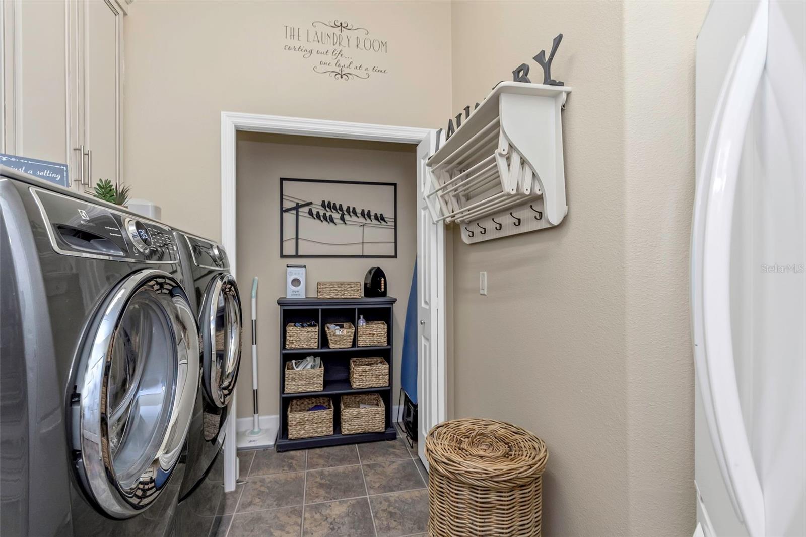 Laundry off the kitchen with full size refrigerator that stays