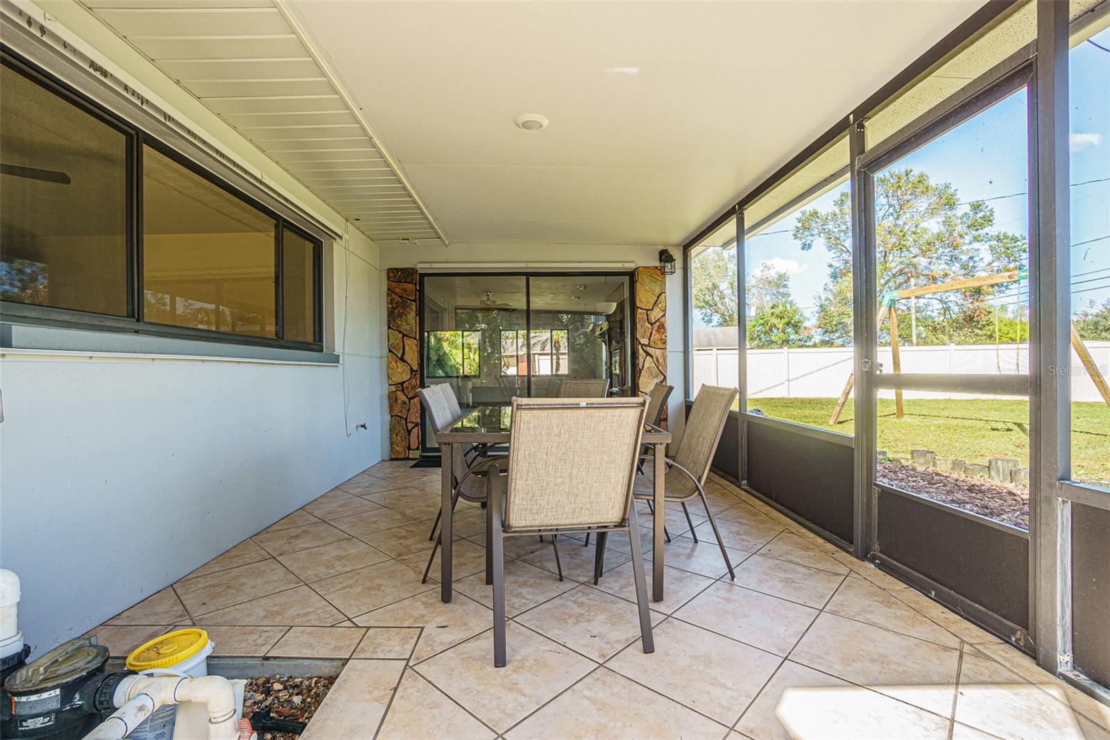 Screened porch with access to family room and backyard.