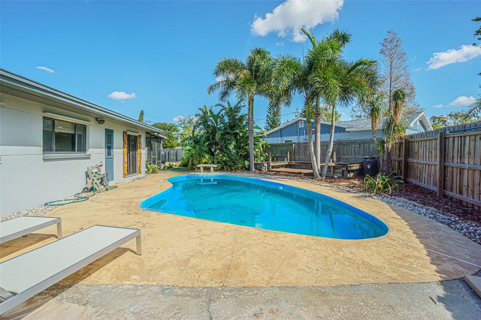 Pool and custom sitting area with two additional ponds.