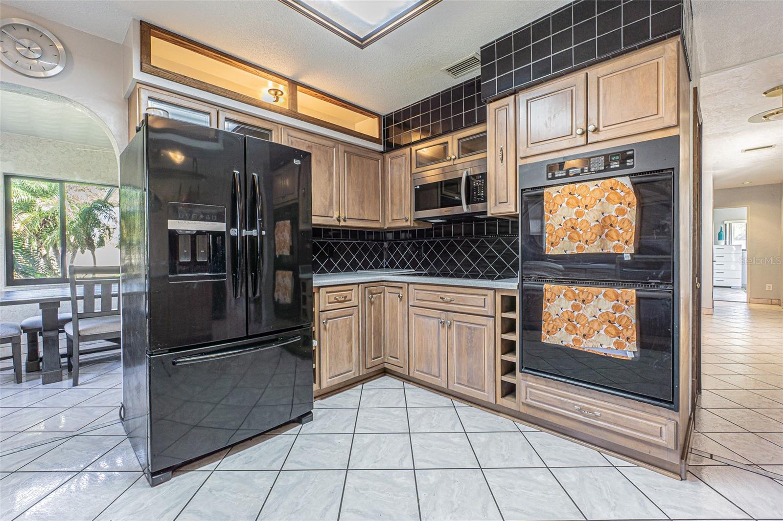 Kitchen with views into the dining room and foyer.