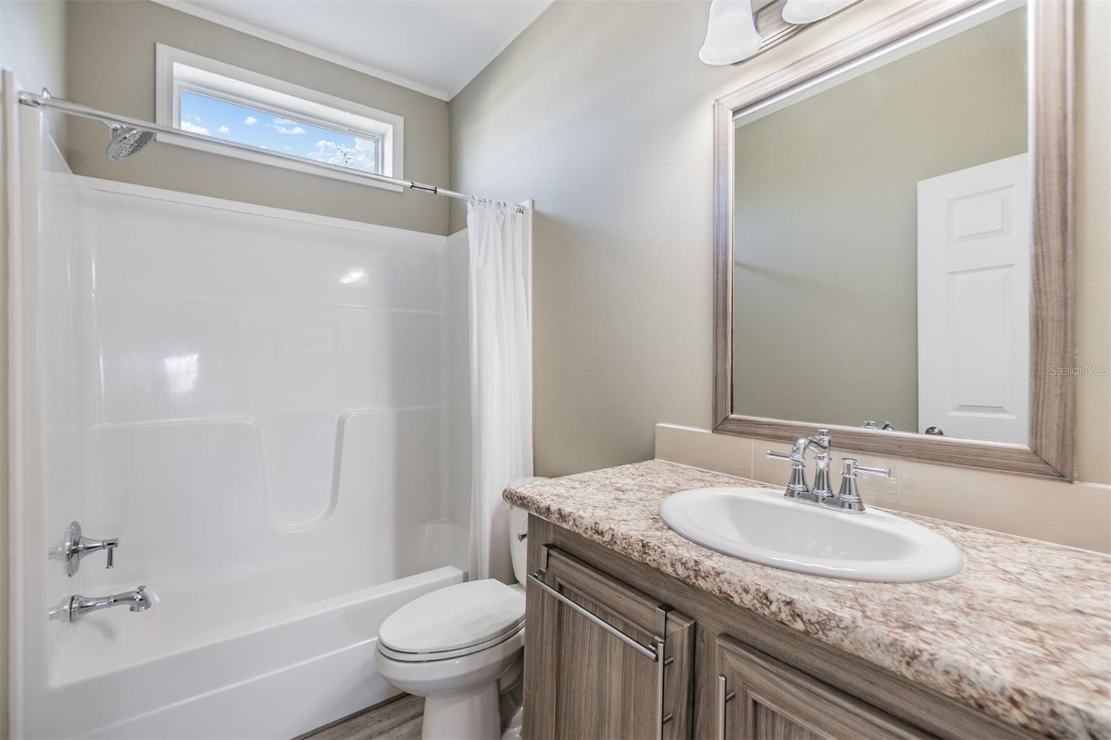 Guest bathroom with tub/shower combo