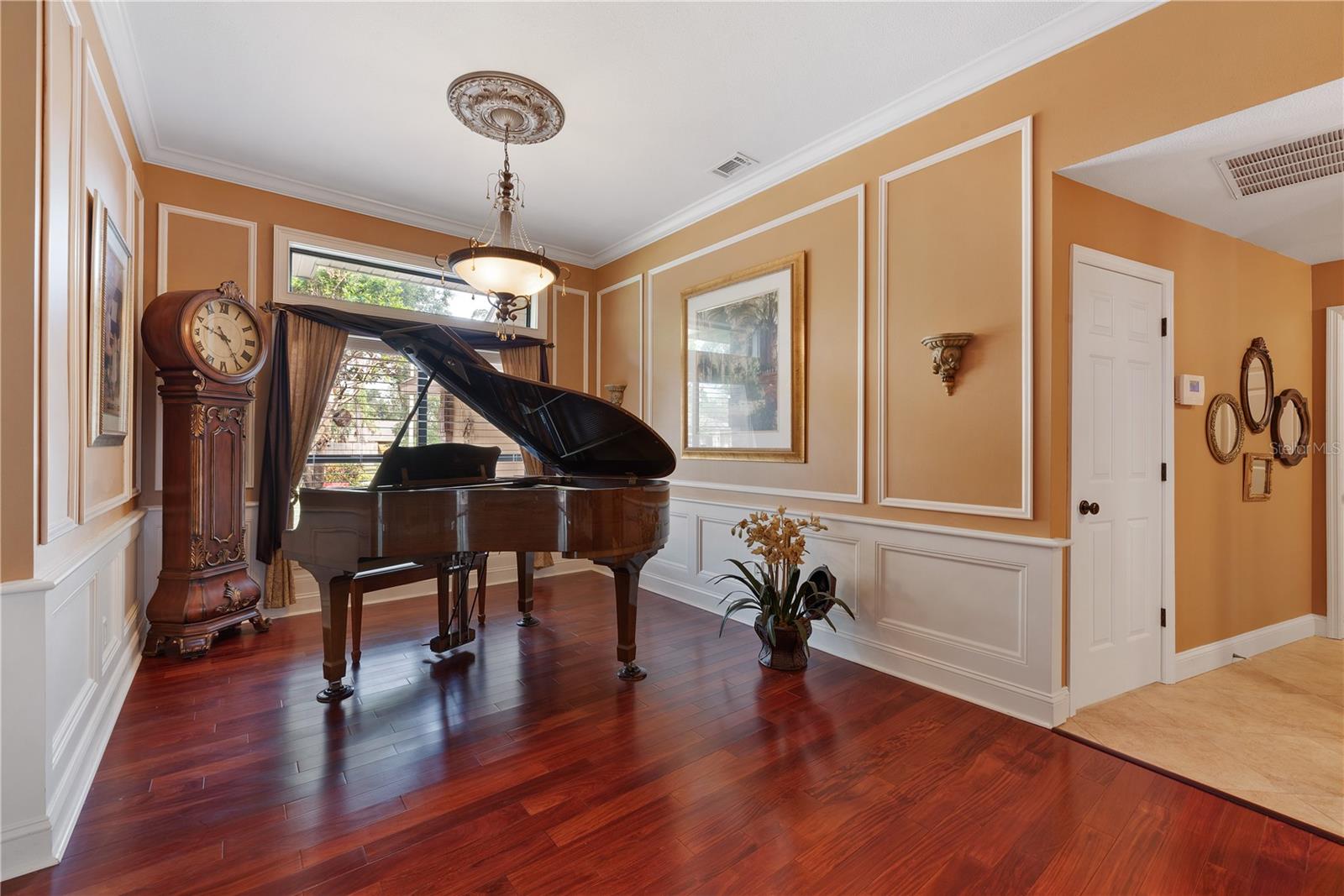 Dining room is 10 x 15 and has custom wainscoting and millwork with plenty of room for a large table.