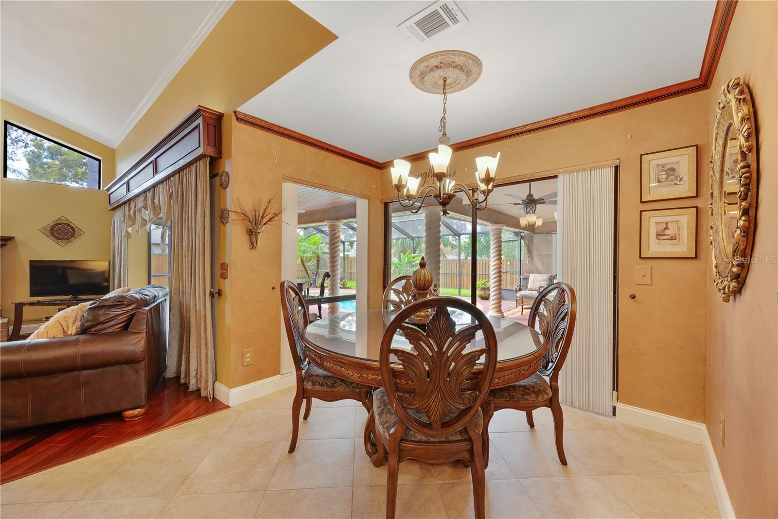 Kitchen Dinette area overlooks the pool and patio with a sliding door for access.