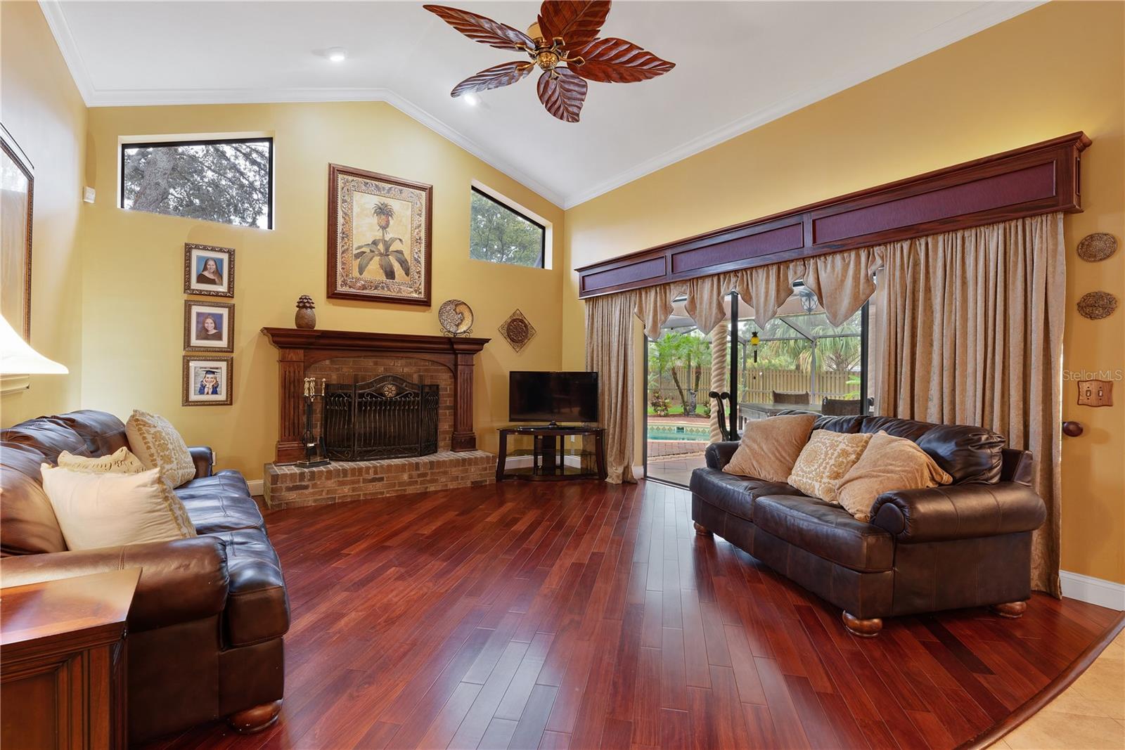 Spacious family room has a cozy wood burning fireplace that enhances the charm of this home.