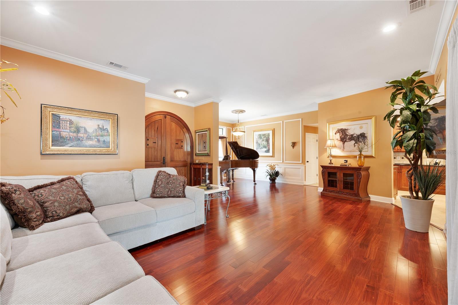 Brazilian Mahogany wood floors and premium custom wainscoting and millwork throughout.