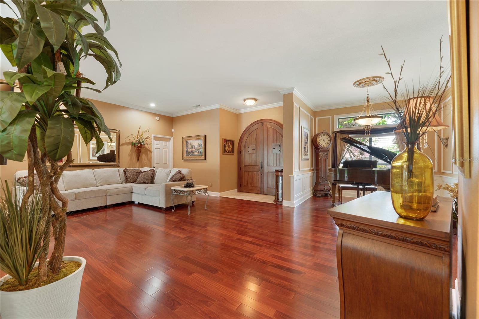 View of front entry and formal living spaces from kitchen.