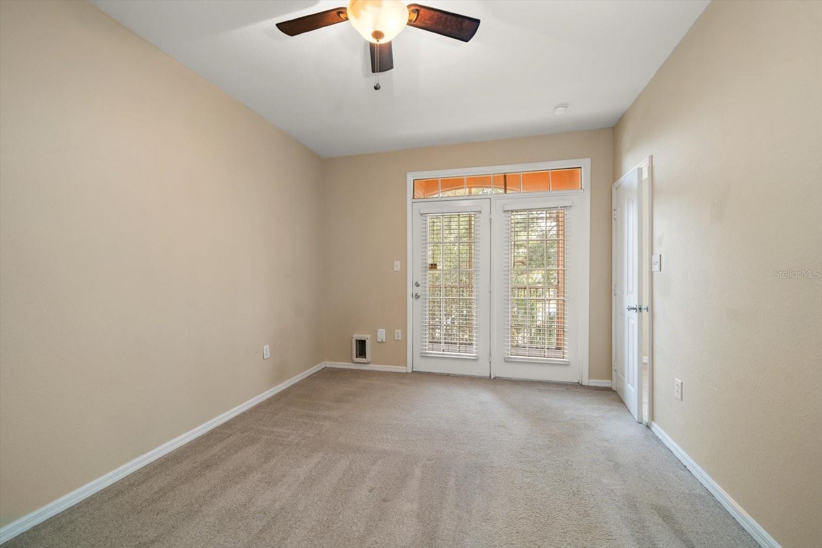 Bedroom 1 with French doors leading to patio!