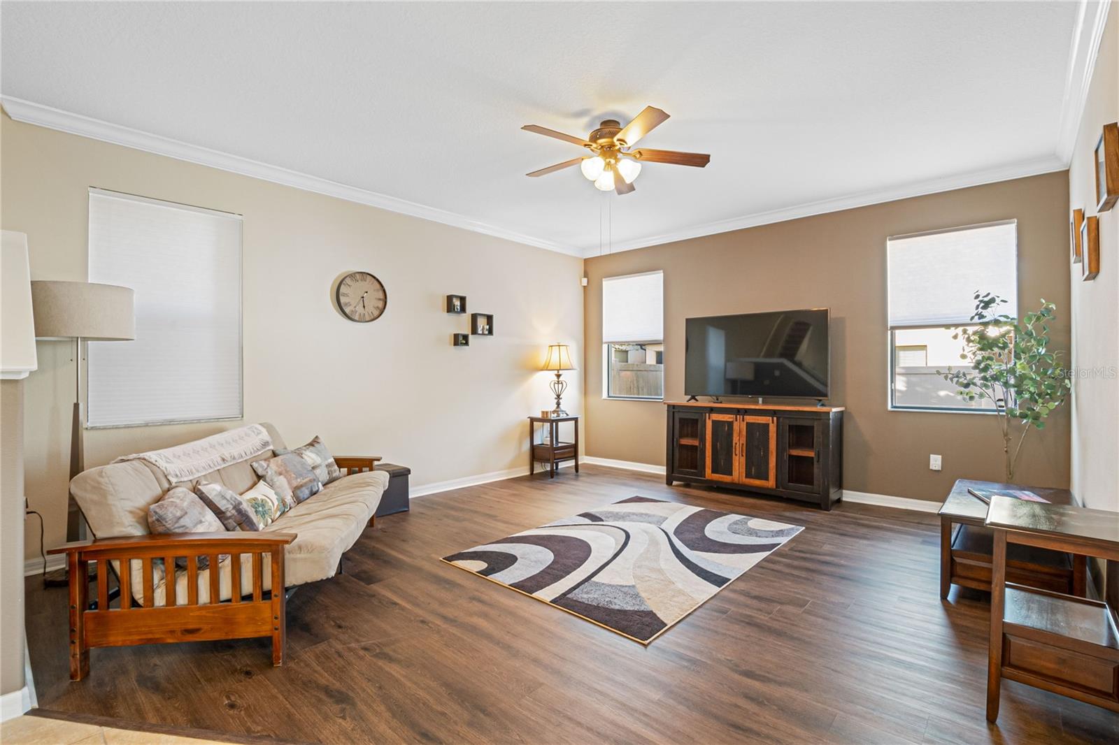 Spacious living room with luxury vinyl plank flooring.