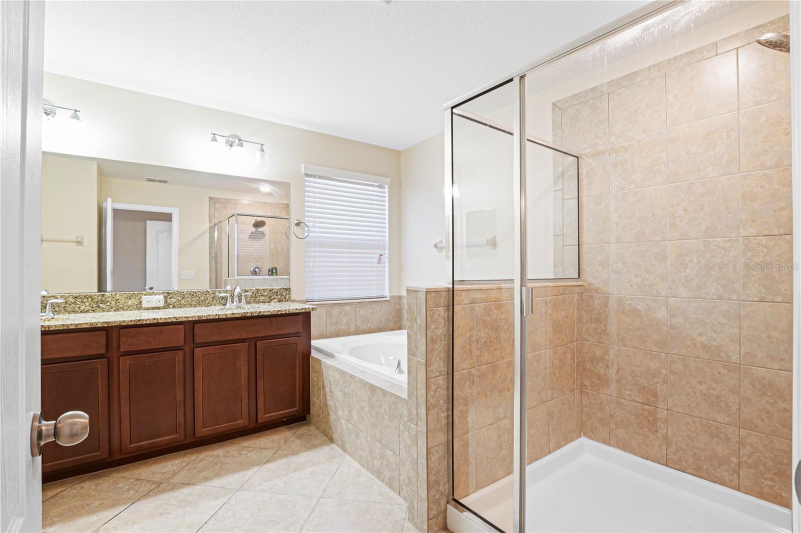 Primary bathroom with garden tub and separate shower.