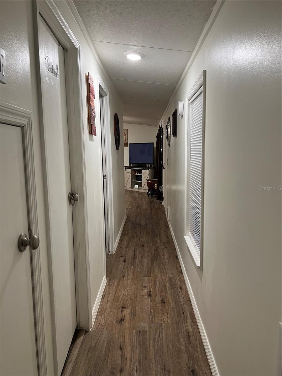 Hallway as you enter through the right carport area, pass the laundry area.