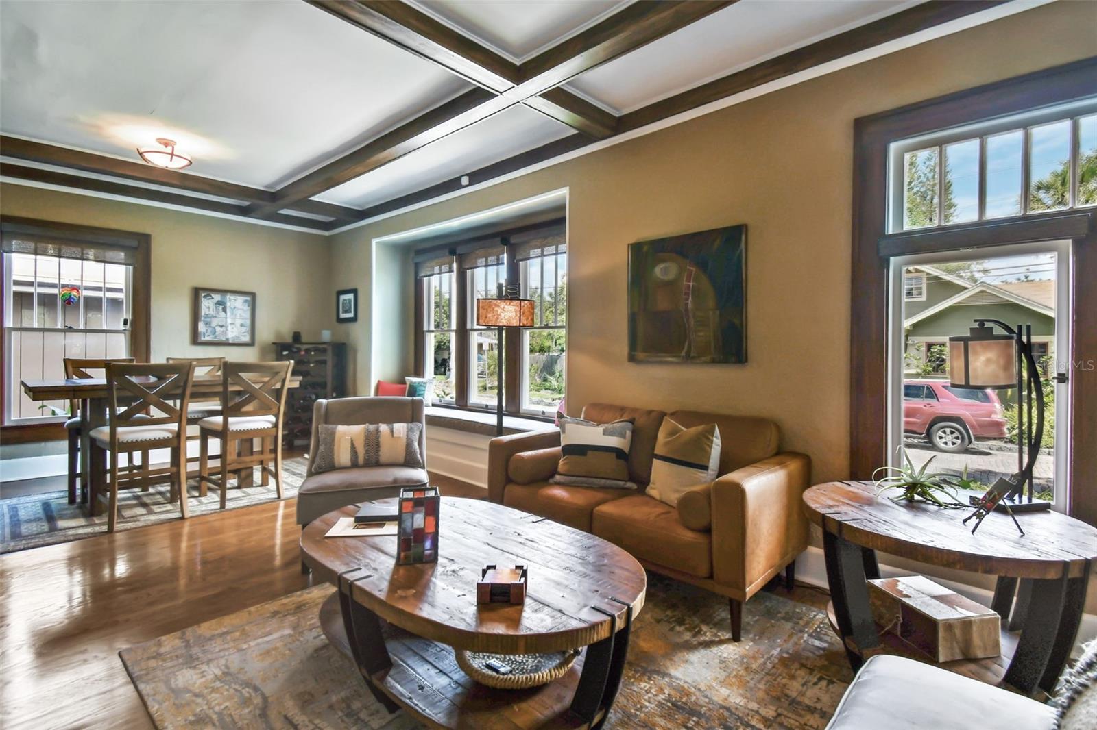 Light filled living and dining space, and custom pull down shades.