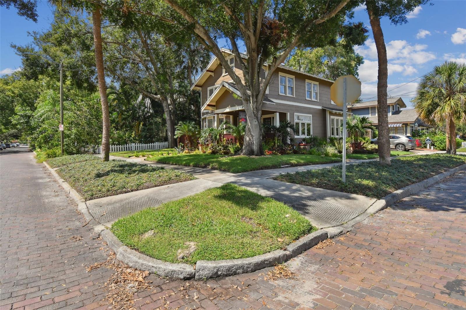 Beautiful corner location with Augusta brick streets and granite curbs.