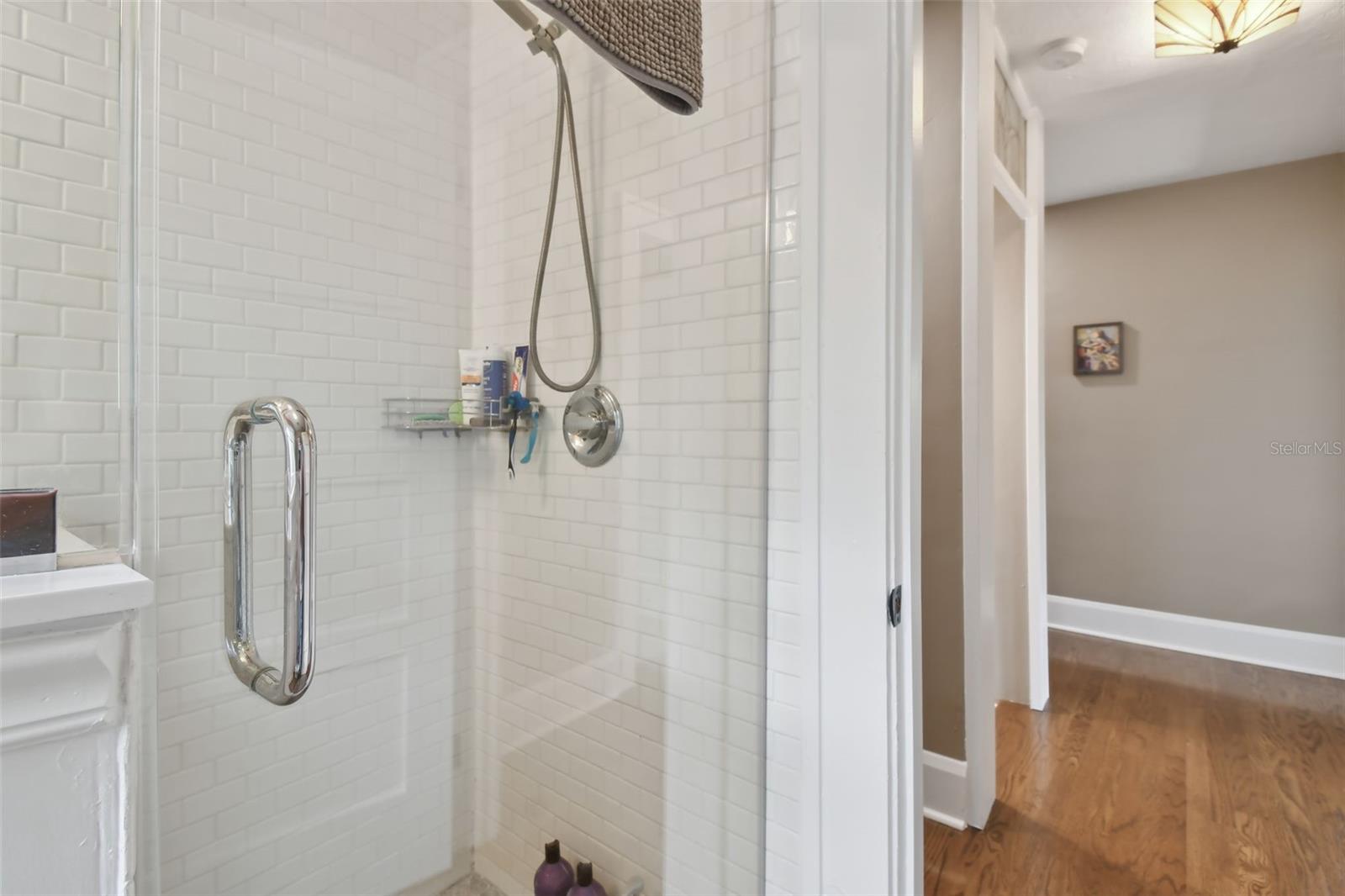 Subway tile upstairs walk in shower