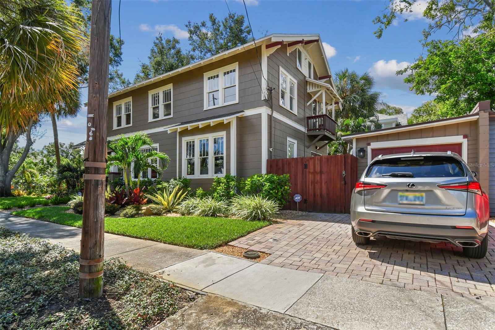 Side garage and parking pad for your golf cart or additional car.