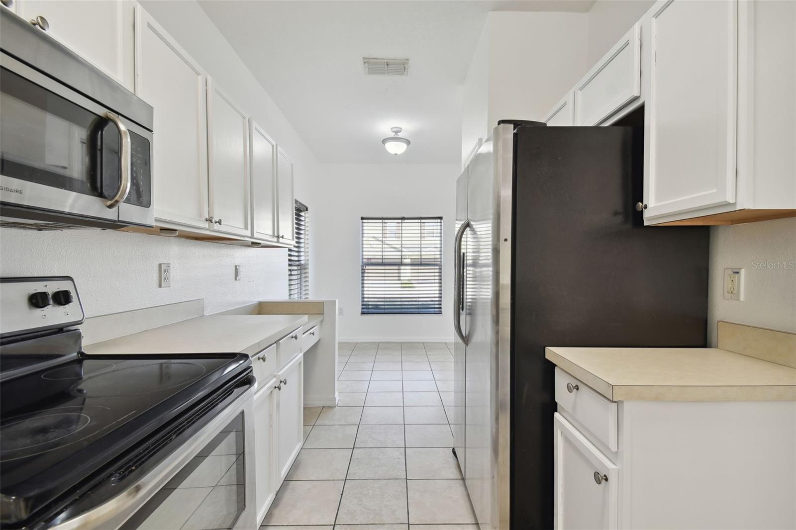 freshly painted kitchen with views of the dinette