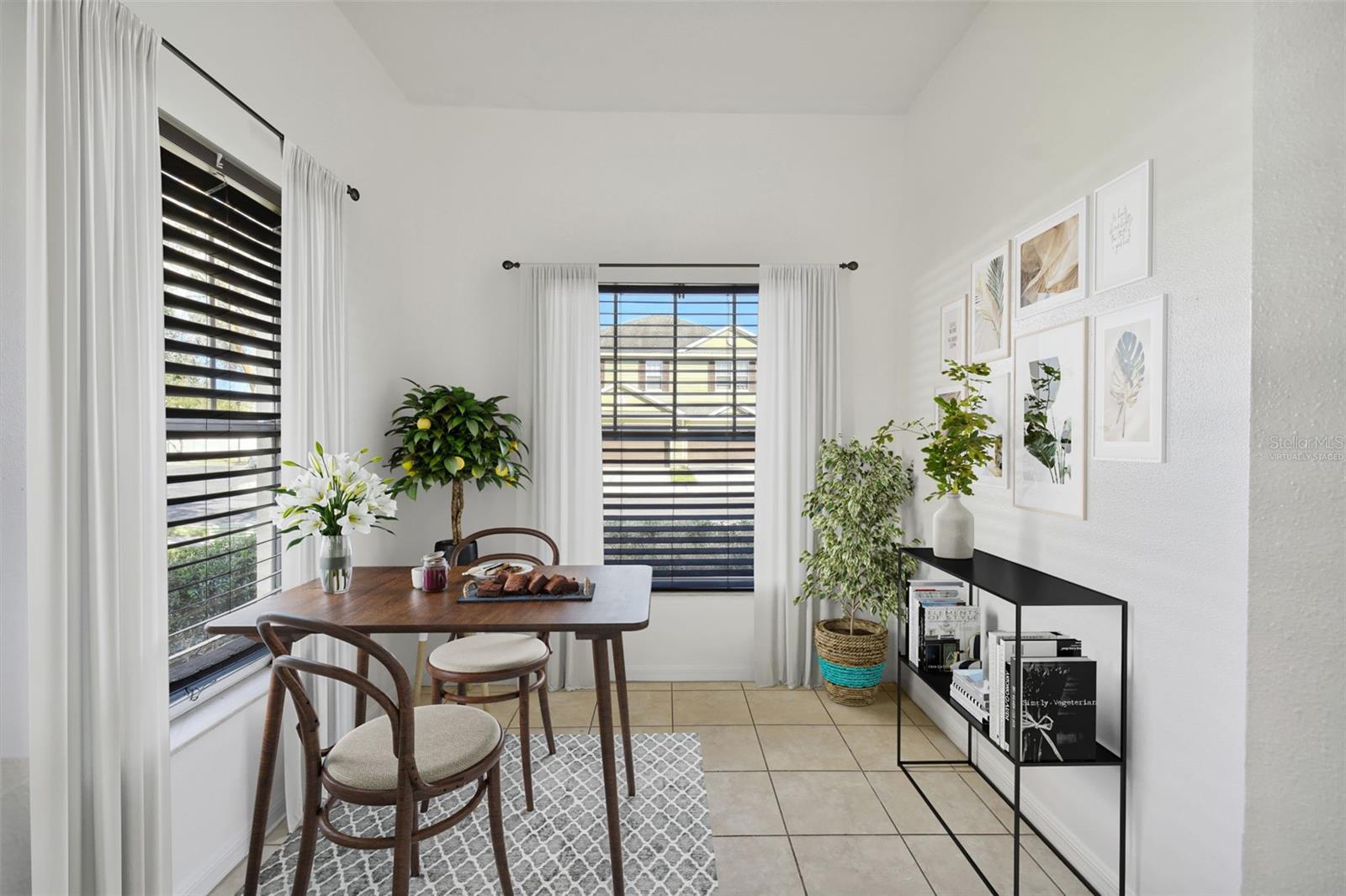 kitchen dinette with multiple windows for ample lighting (virtually staged)