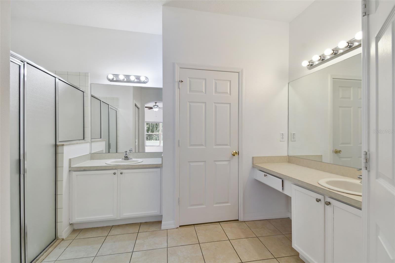 master bathroom with fully lit vanity