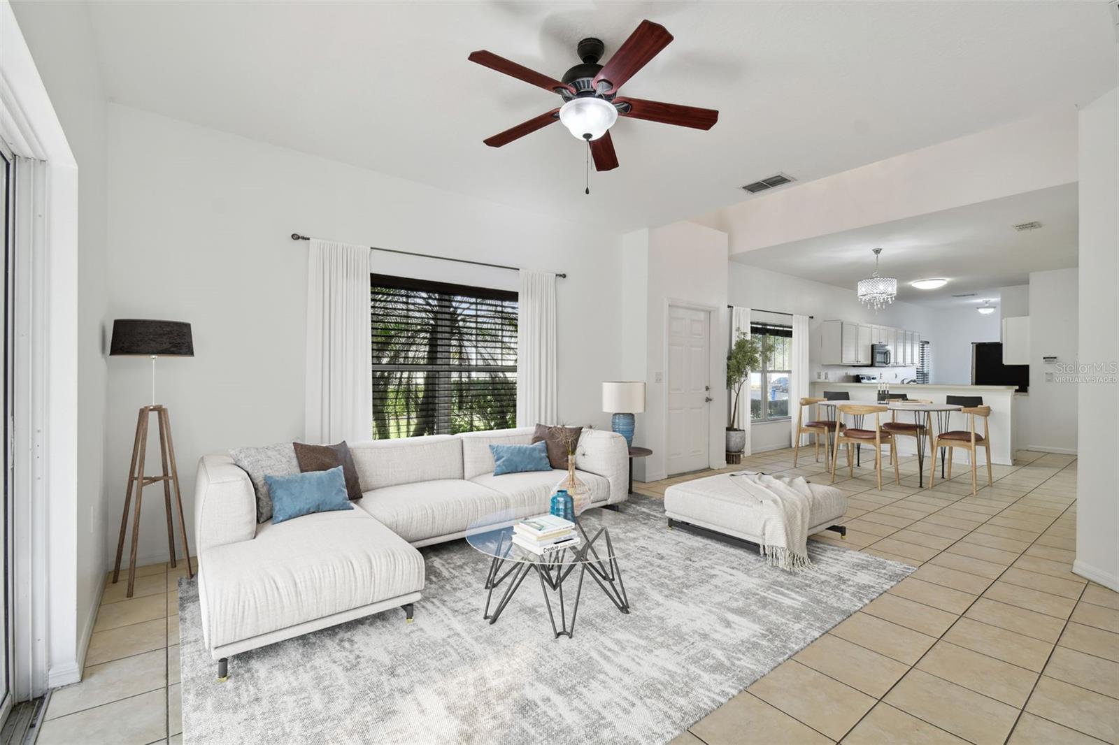 living room with kitchen views (virtually staged)