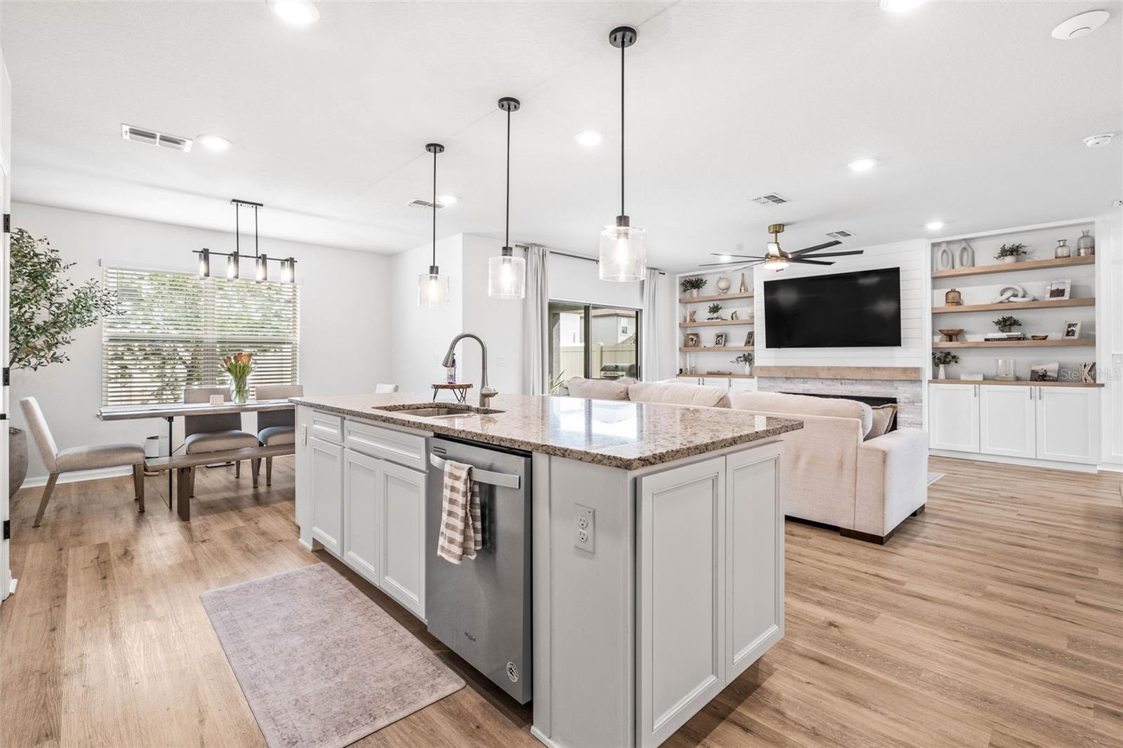 Additional cabinet space at the island and accessibility to the dining area makes the space perfect for entertaining.