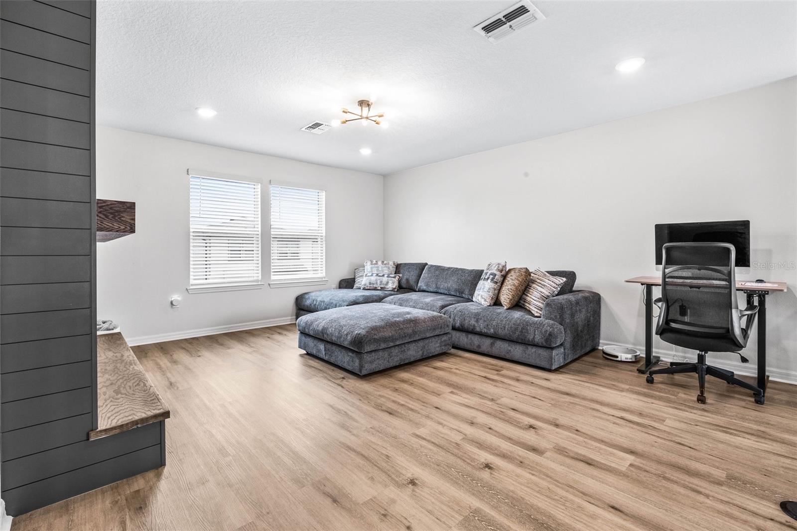 As we venture upstairs your loft has a built in wall & mantle, lux vinyl flooring throughout, and flexibility of design in this split floor plan.