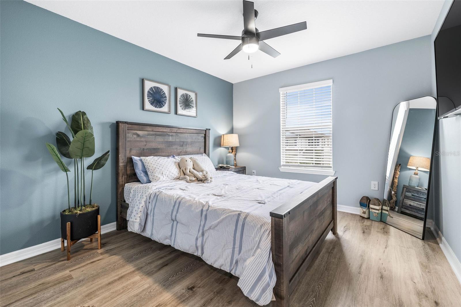 Bedroom 4 with overhead fan/lighting.