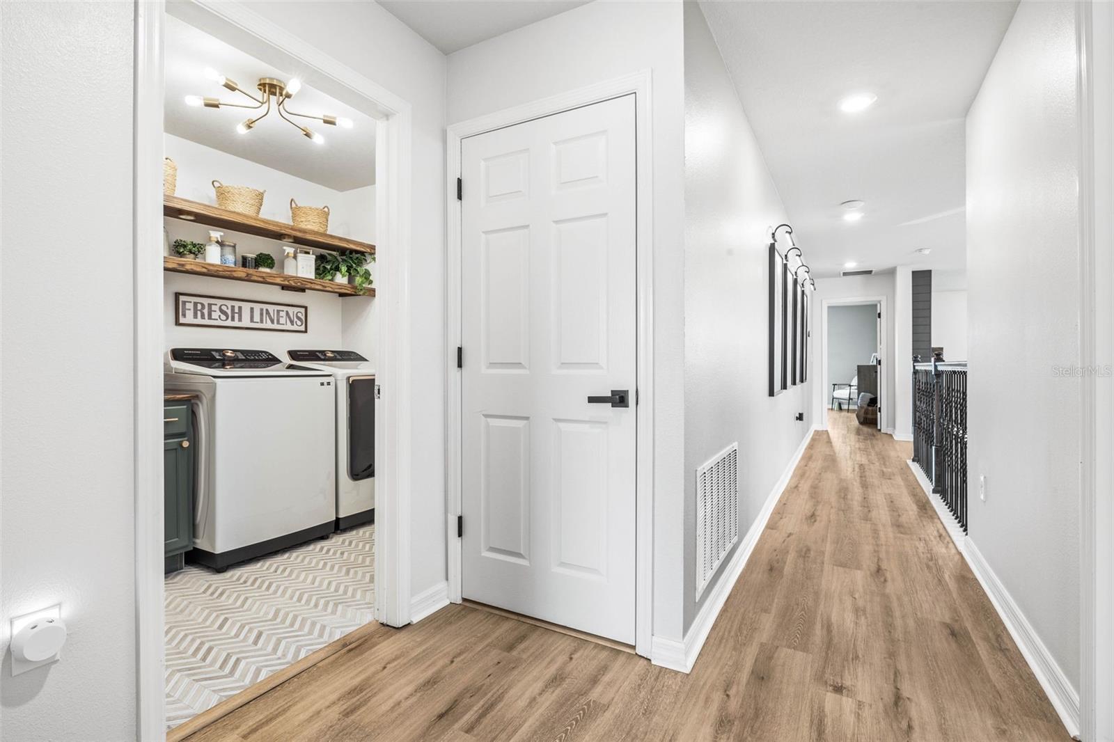 The hallway to this split floor plan also leads to the laundry room.  The attention to detail is unparalleled.