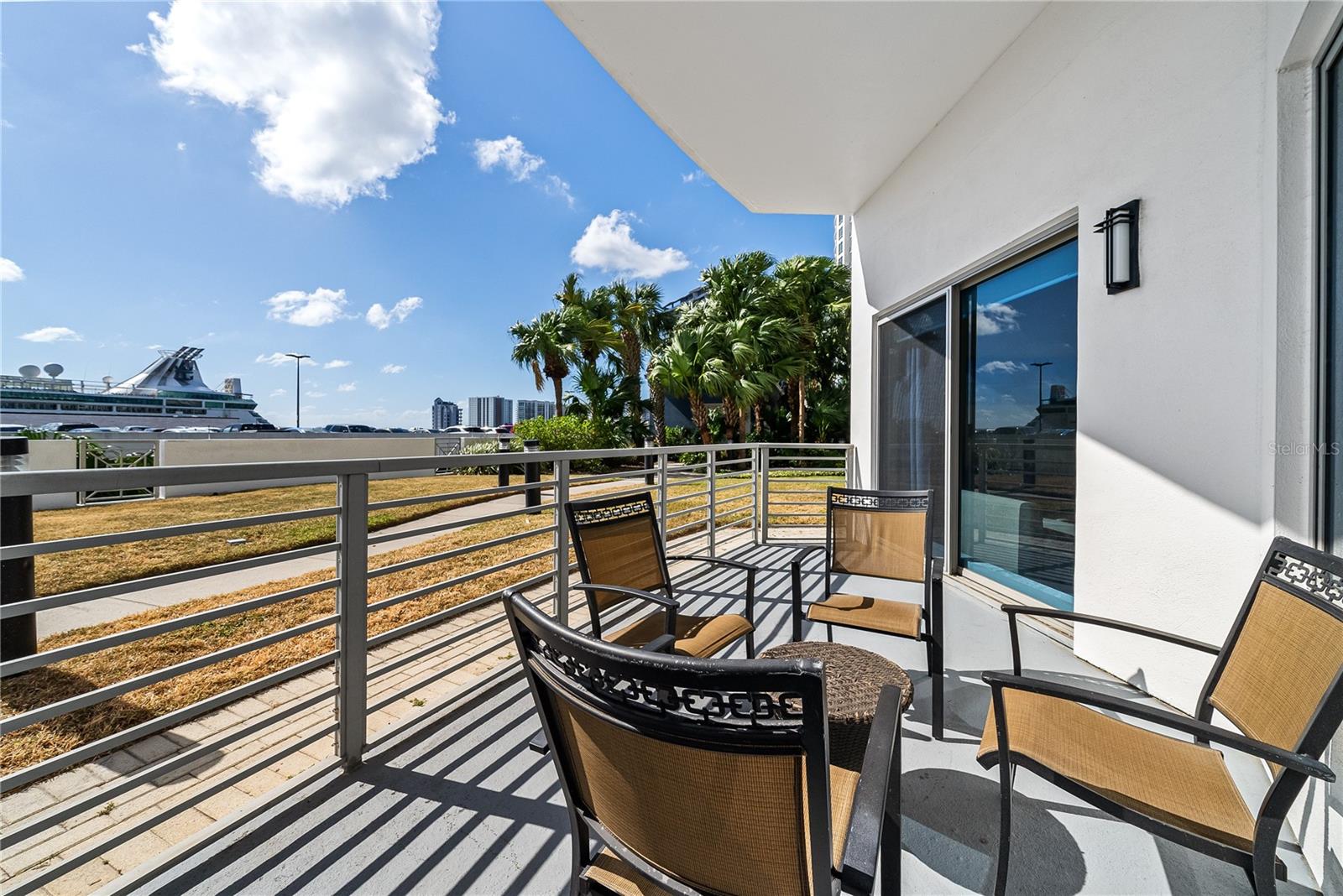 Beautiful wrap around patio with cruise ship views and easy access to the pool