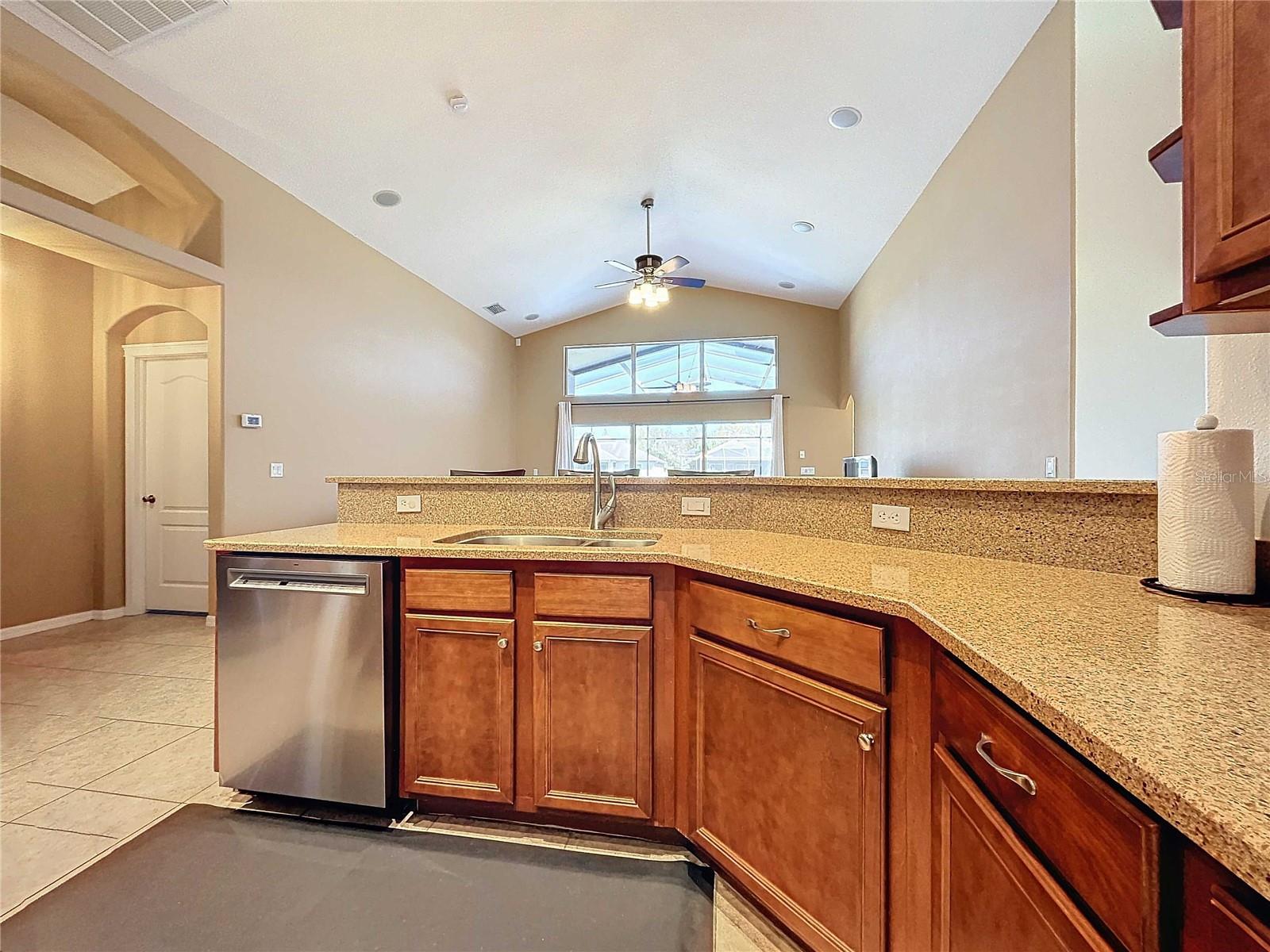 Kitchen featuring new stainless steel dishwasher