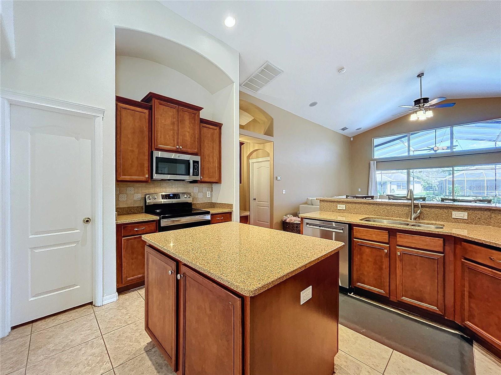 Kitchen featuring large island & new paint