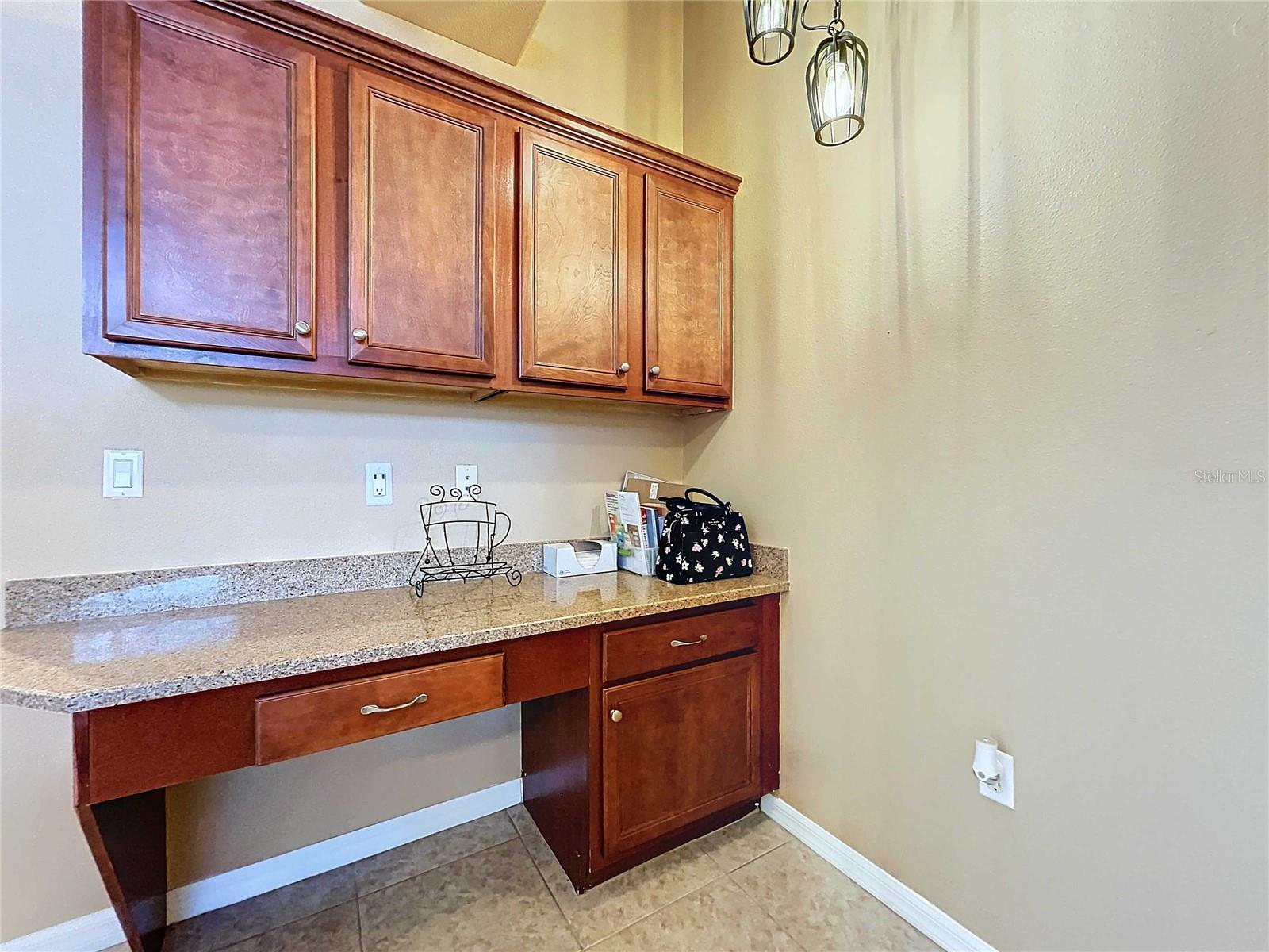 Recipe desk and cabinetry off of kitchen