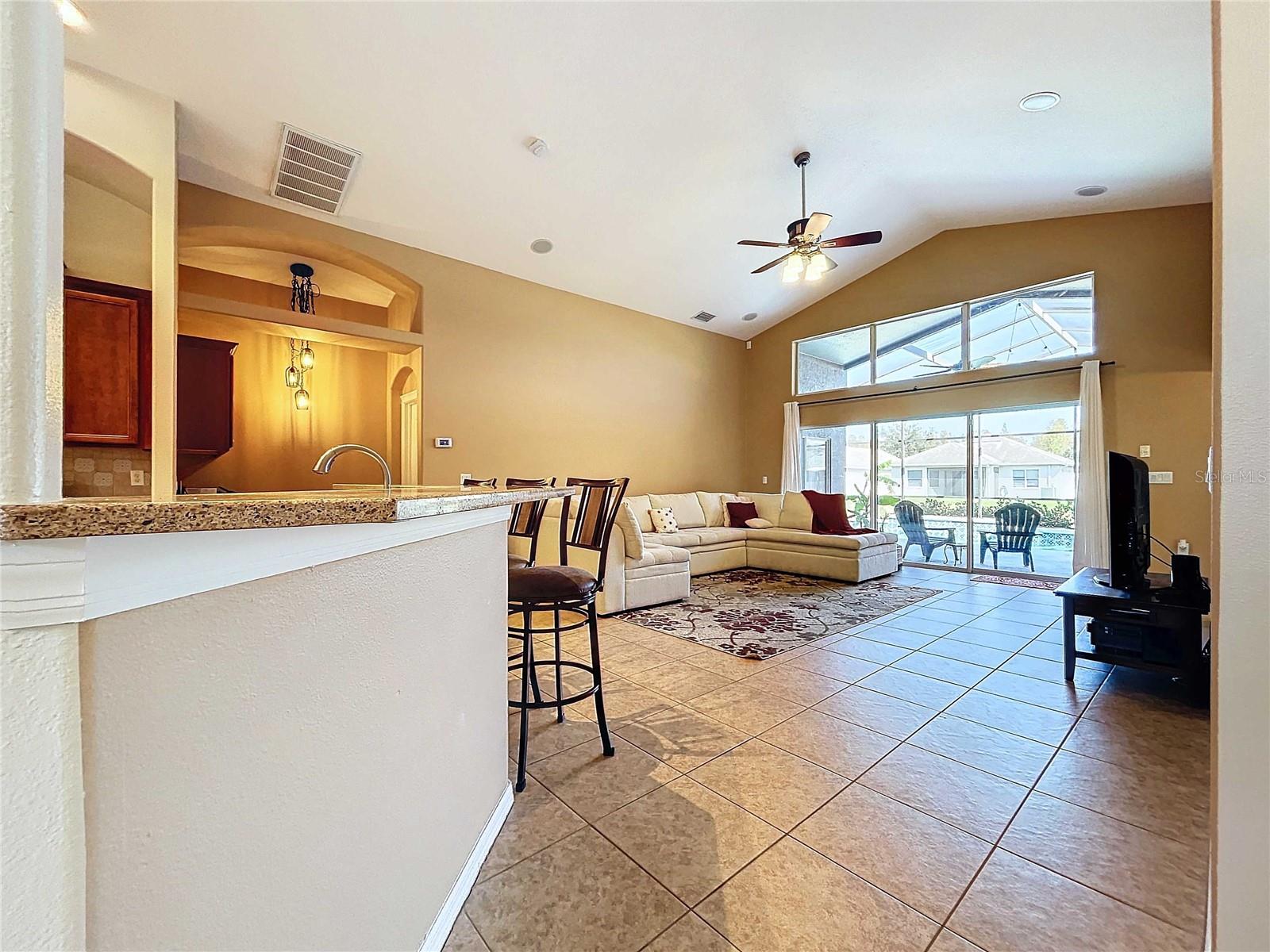 Kitchen looking towards great room with high ceilings