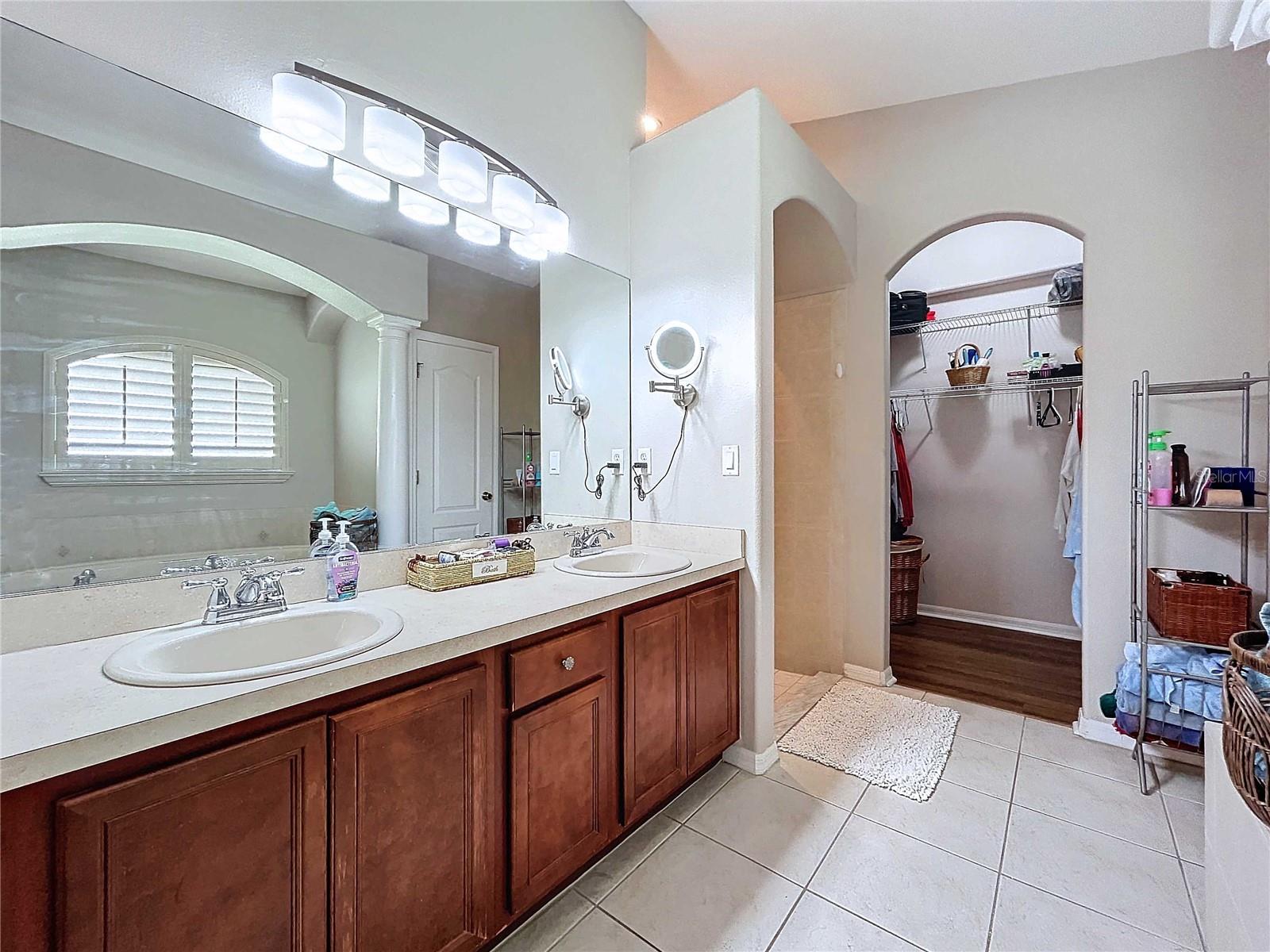 Primary bathroom lookng towards walk-in closet