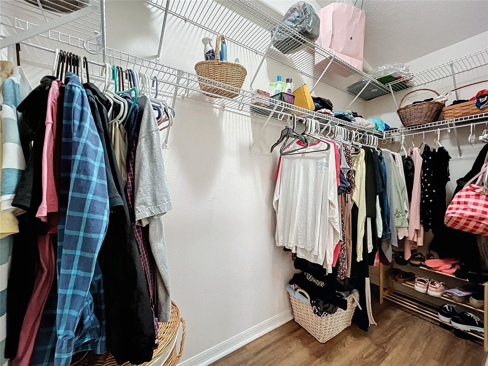 Primary bedroom walk-in closet