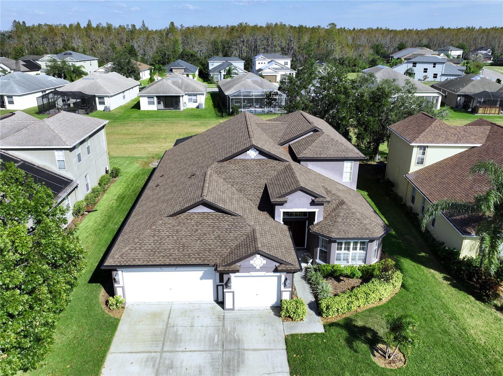 Front aerial view featuring new roof 2023