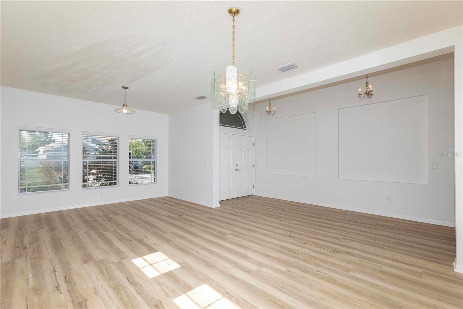 Newly installed matching vinyl floors throughout the house