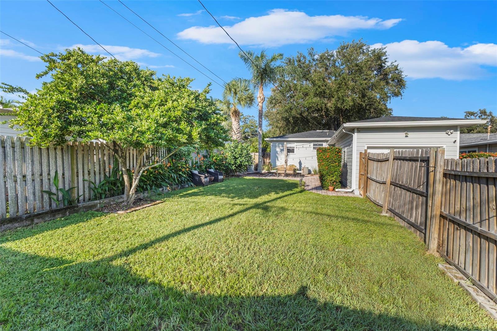 new fence in backyard, plenty of room for games