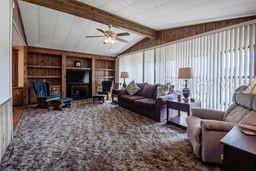 Living Room with Vaulted Ceilings and Large Front Window