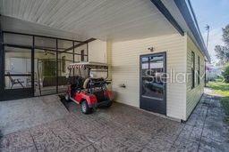 Covered patio for cooking, parking golf cart, Workroom is under roof