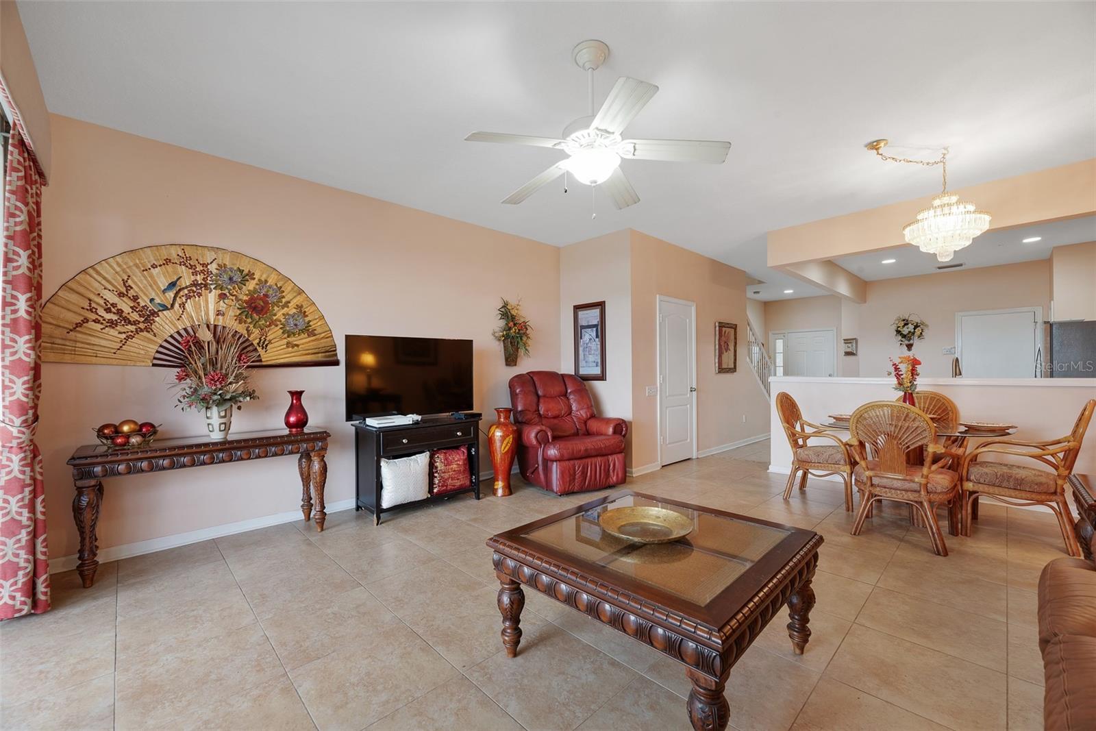 Notice the convenient half bathroom tucked under the stairs.