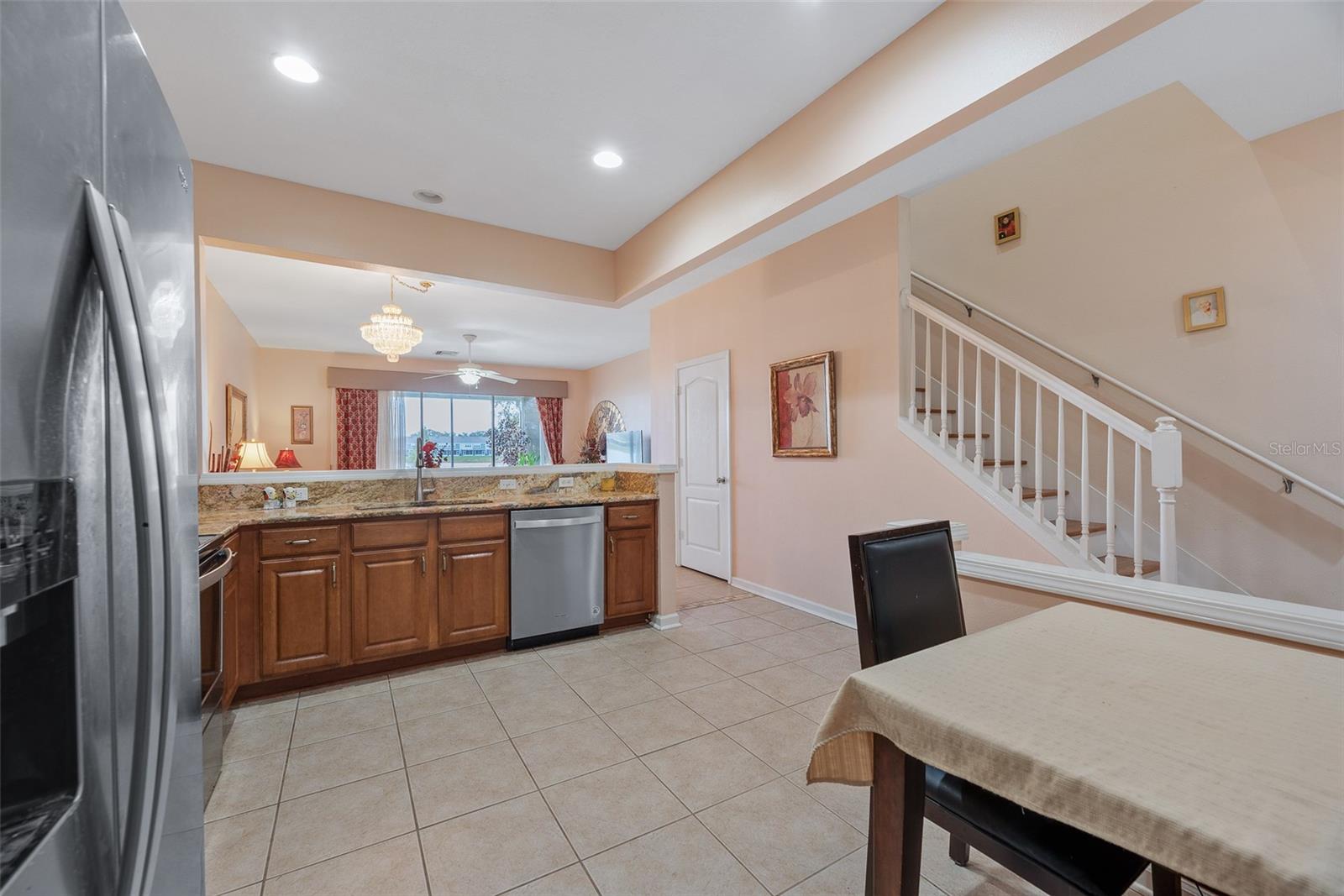 The kitchen has stainless steel appliances, a closet panty, and granite counter tops.