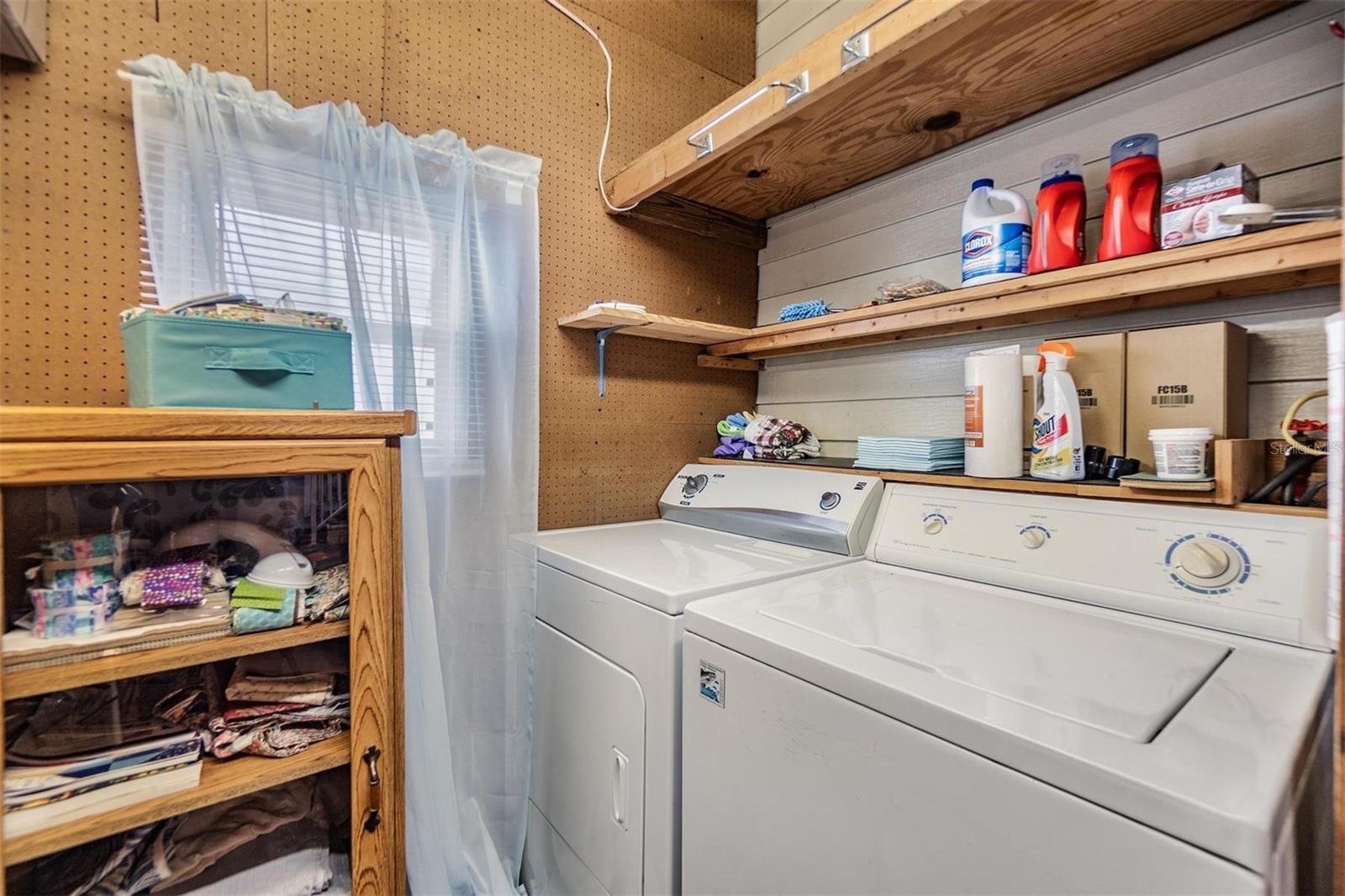 Inside laundry off Florida room.