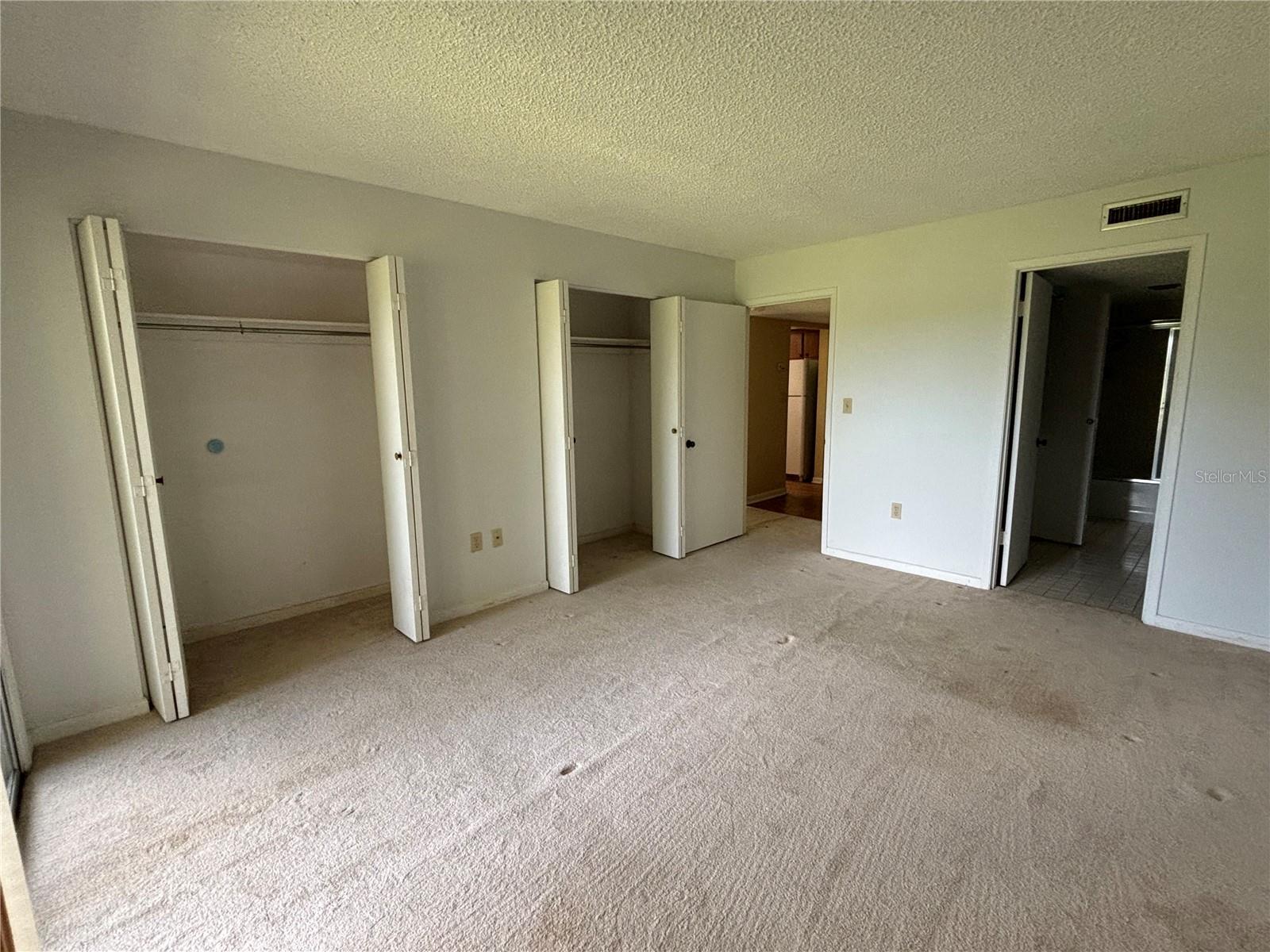 Primary Bedroom with Double Closets and Ensuite Bath