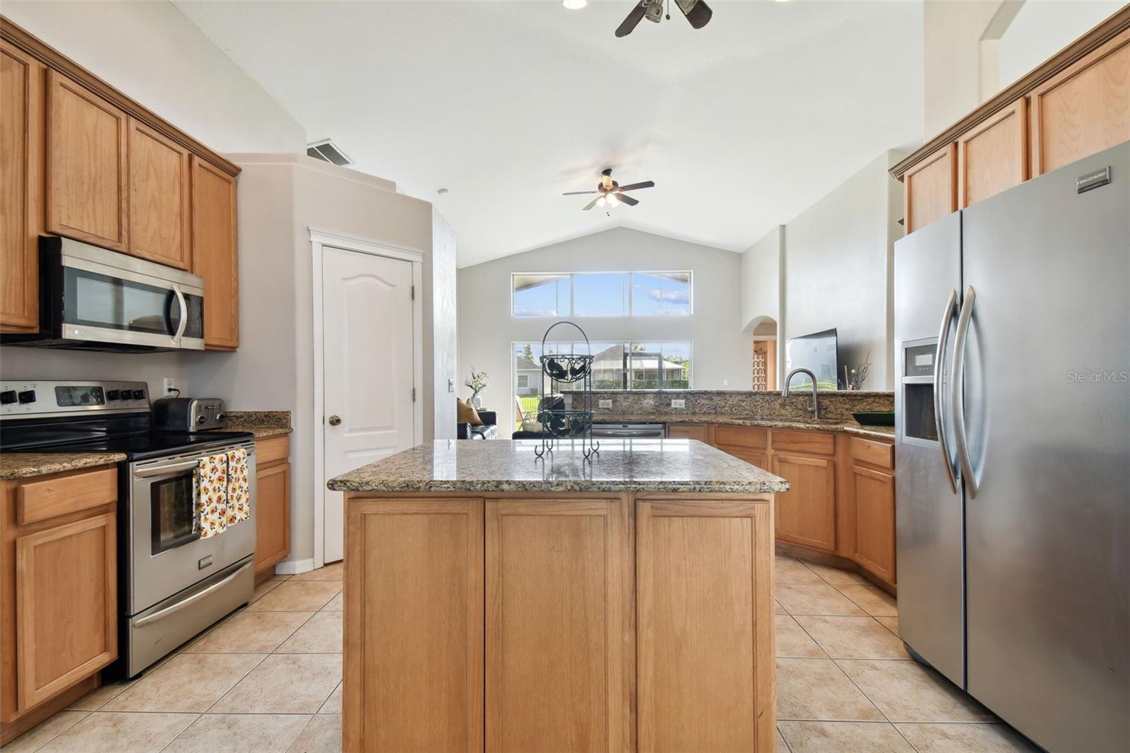 Beautiful Granite Countertop with dramatic veining, highlights its unique and durable beauty. Undermount sinks, newer faucents and light fixtures make a statement in this en-suite.