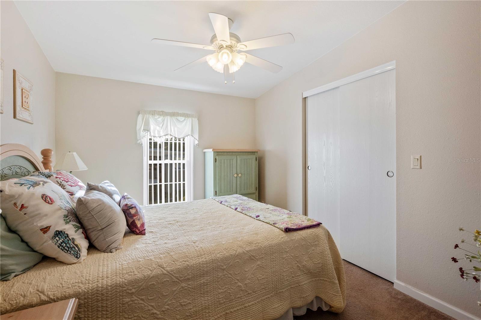 Bedroom two has walk-in closet, ceiling fan and large enough for a king bed.