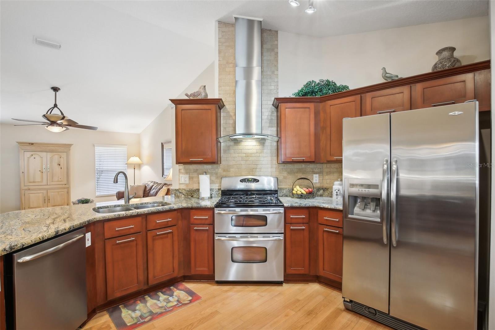 Kitchen with wood cabinets,stainless appliances, granite countertops