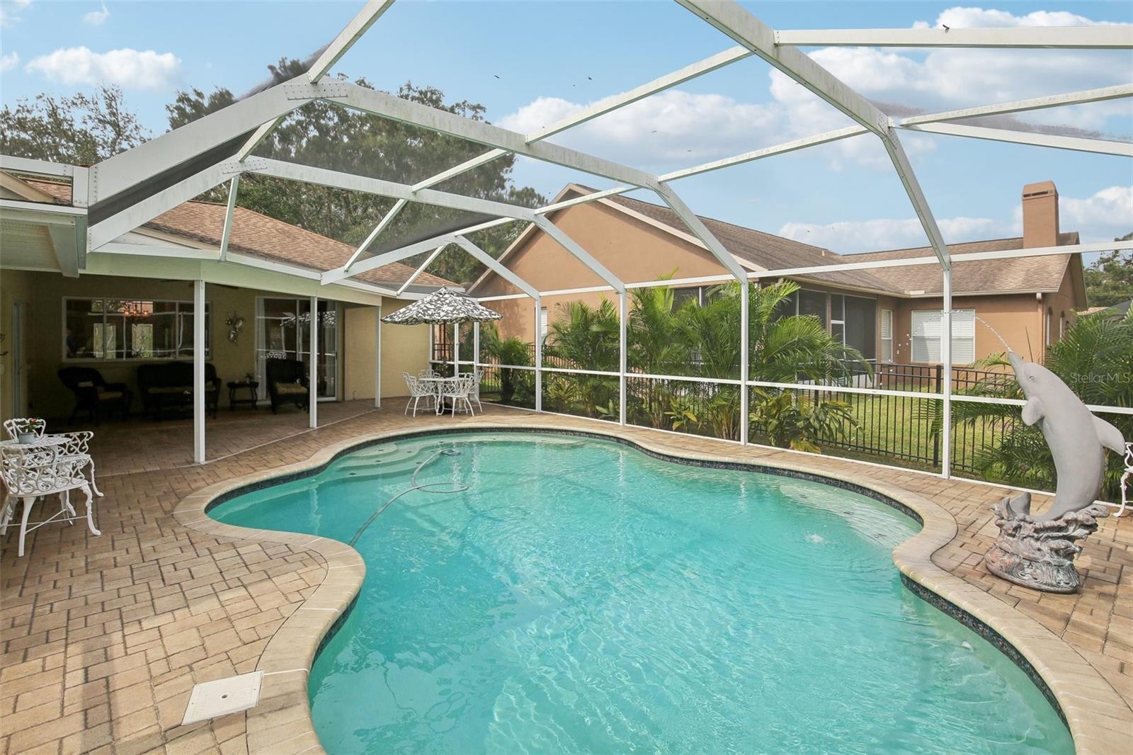 custom pool with dolphin fountain