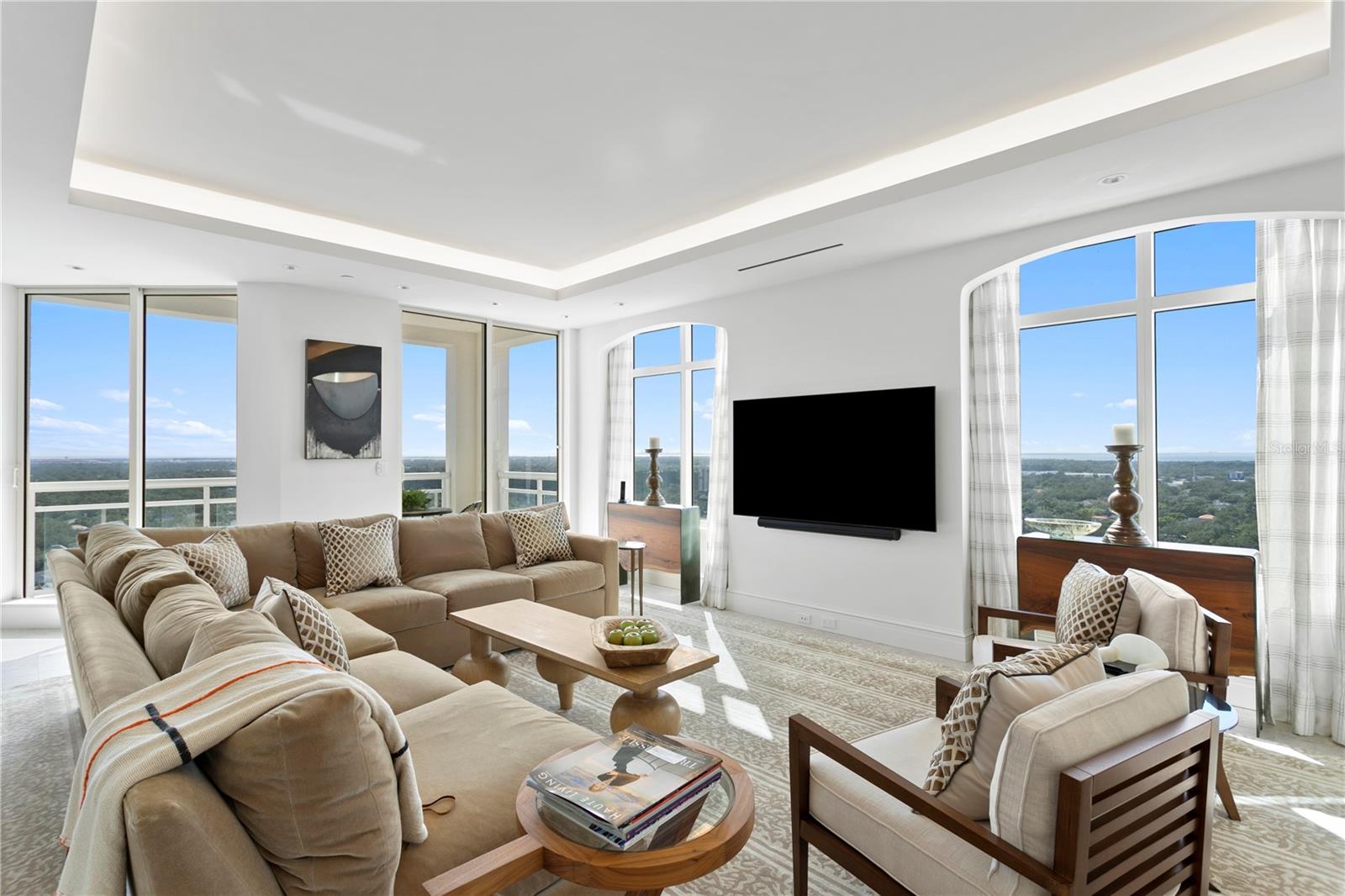 Family room loaded with windows showing off western and southern views perfect for dinner on the balcony