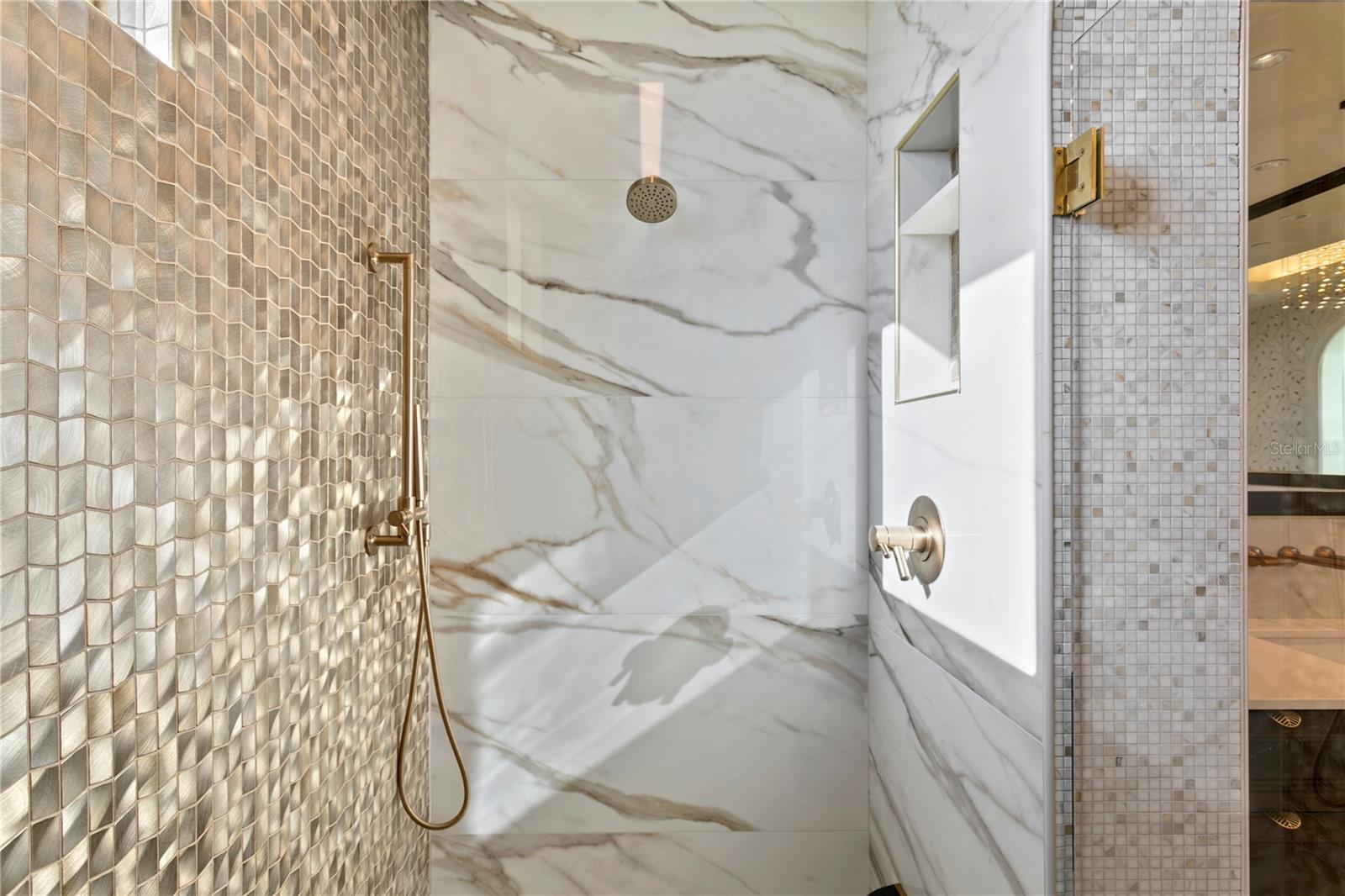 Primary Suite shower with luxury marble and finishes