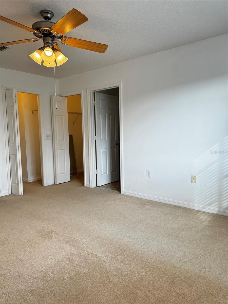 Master bedroom with 2 walk in closets