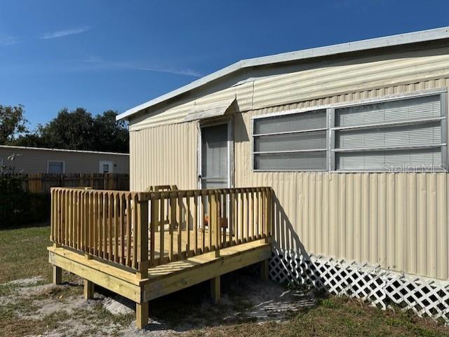 BACK PORCH-ENTRANCE TO PRIMARY BEDROOM